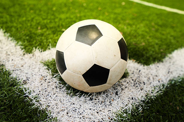 istock soccer field center and ball top view background 539968066