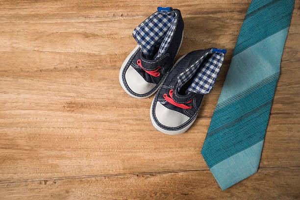 istock Daddy's boots ,baby's shoes ,Textile hearts ,gift  and  blue nec 539969876