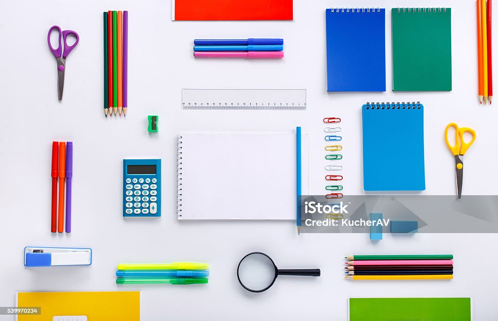 School supplies with a notebook with blank pages School supplies with a notebook with blank pages for your text on a white background. Flat lay, top view Storage Room Stock Photo