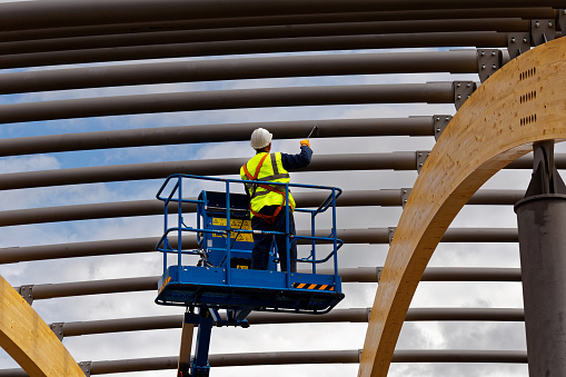 man painting steelwork