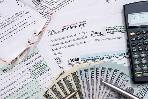 istock dollar bills and tax form 539972278