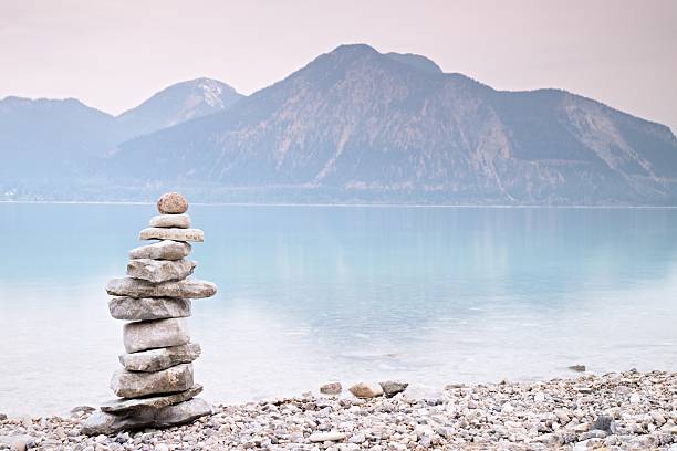 istock Balanced stones on mountain  lakeshore. Children built pebbles pyramid 539972862