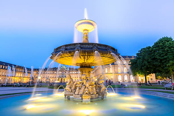 Stuttgart city center, Germany at dusk Fountain at neues Schloss New palace in Stuttgart city center, Germany at dusk stuttgart stock pictures, royalty-free photos & images