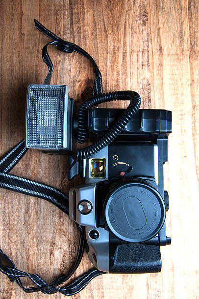 istock Old camera on a wooden background 539974198