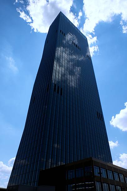 istock High rise office tower with blue windows  sky. Modern building 539974744