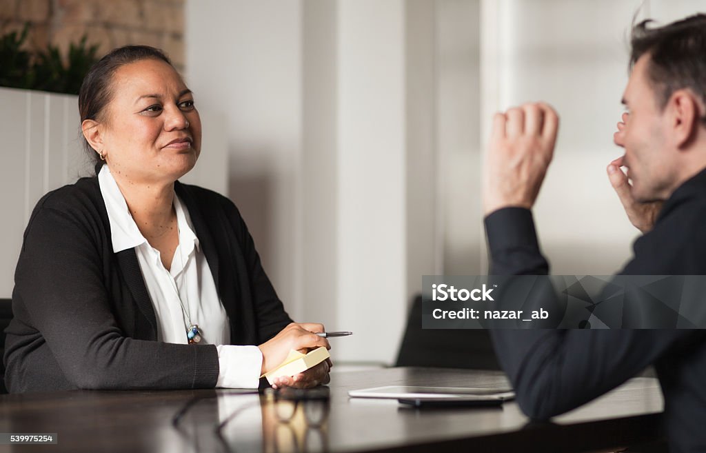 Mixed Race People in Meeting Two different ethnicity People Holding a meeting. Māori People Stock Photo