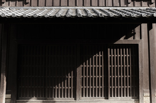 This is the traditional lattice windows of Japan. There is a shadow under the eaves.
