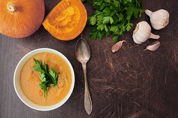 Pumpkin soup with herbs stock photo