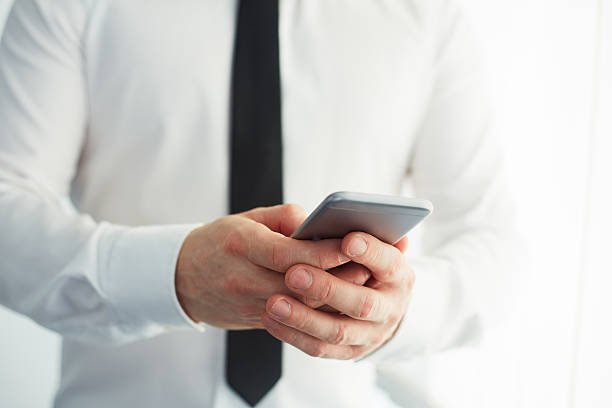 istock Man holding a smartphone and writing 539980050