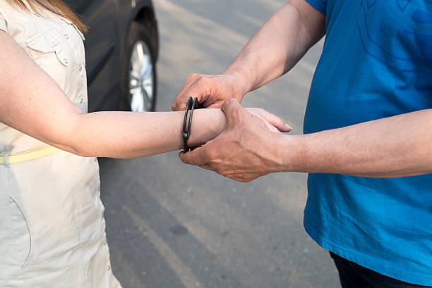 istock the arrest of a young woman 539980530