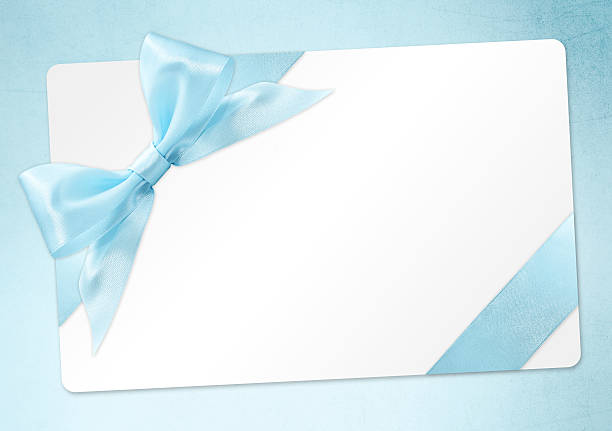 istock gift card with blue ribbon bow Isolated on azure background 539980868