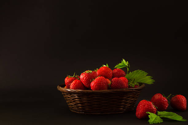 istock strawberries in a basket on a black background 539981000