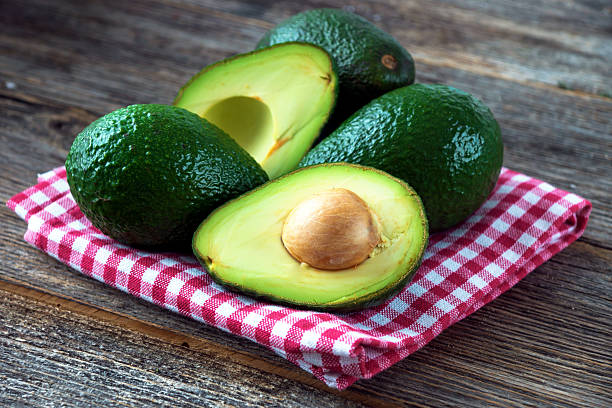 istock Avocado on wooden background 539983884
