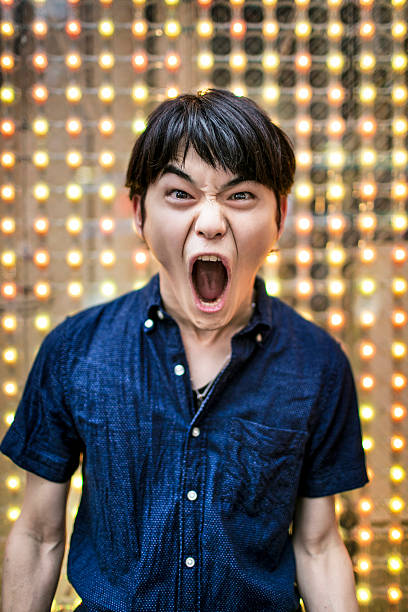 Shouting loud Young Japanese man shouting loud. men close up 20s asian ethnicity stock pictures, royalty-free photos & images