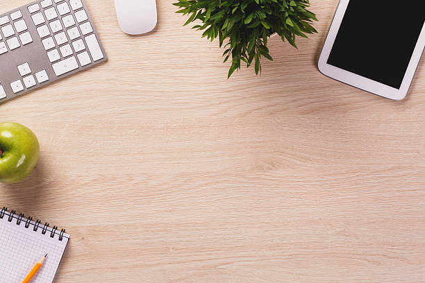 istock Top of desk with empty space and office equipment. 539985948
