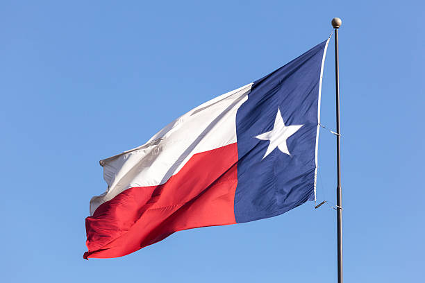 istock Flag of Texas against blue sky 539986210