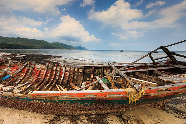 istock abandoned old boat view beside the beach 539986446