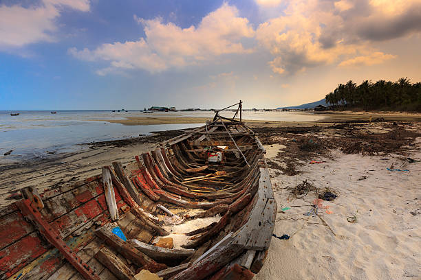 istock abandoned old boat view beside the beach 539986460