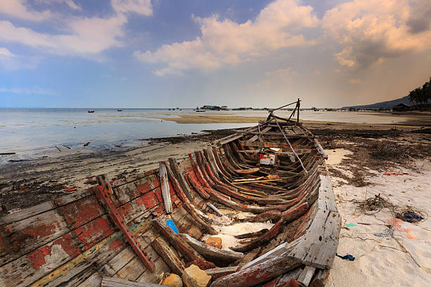 istock abandoned old boat view beside the beach 539986466
