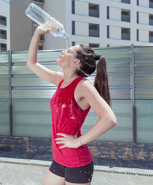 istock Woman splashing his face with water after exercise 539986468