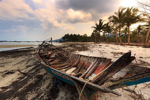istock abandoned old boat view beside the beach 539986562