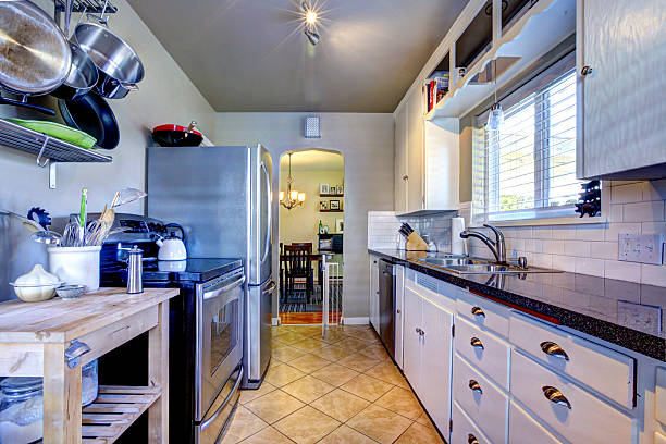 istock Blue kitchen interior with brown tile and stainless steel refrig 539988244