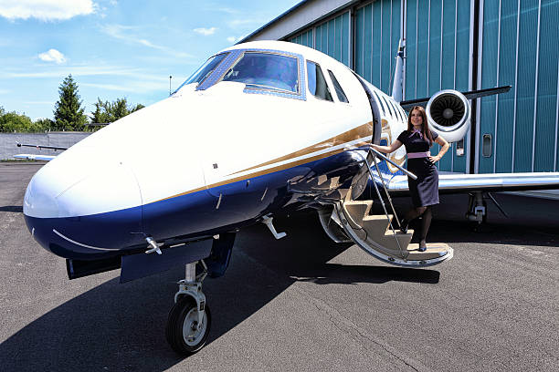 istock Stewardess welcoming on the steps of small jet 540089322