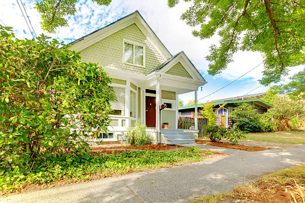 istock Old small green home with porch 540089340