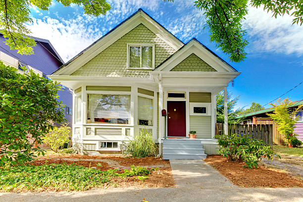 istock Old small green home with porch 540089464