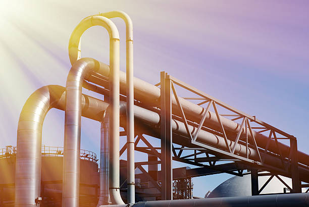 istock industrial pipelines on pipe-bridge against blue sky 540089942
