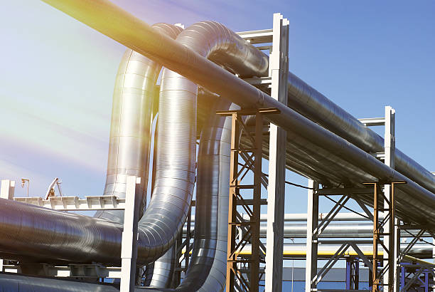istock industrial pipelines on pipe-bridge against blue sky 540090020