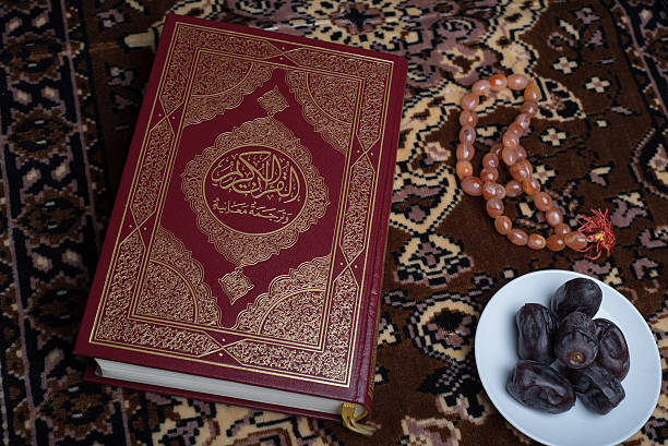 Koran on dark brown carpet