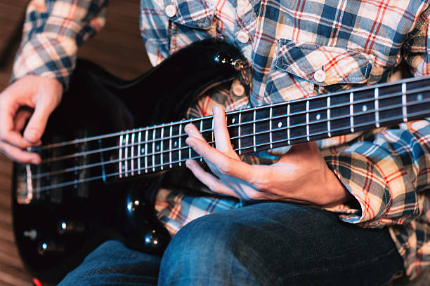 istock Hands playing on bass guitar close-up 540093104
