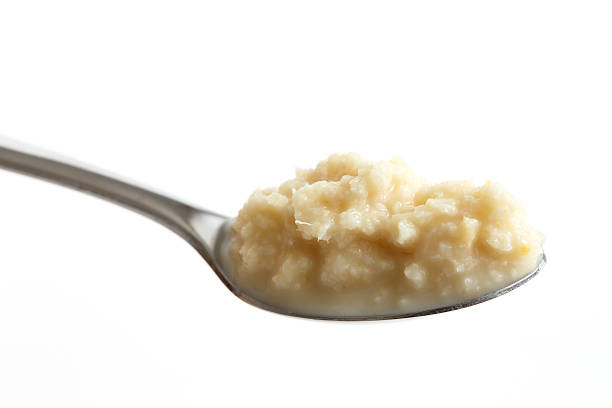 istock Spoon of horseradish sauce in perspective isolated on white. 540093664
