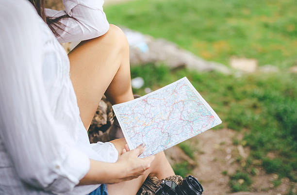 istock woman holding a map outdoors 540094746