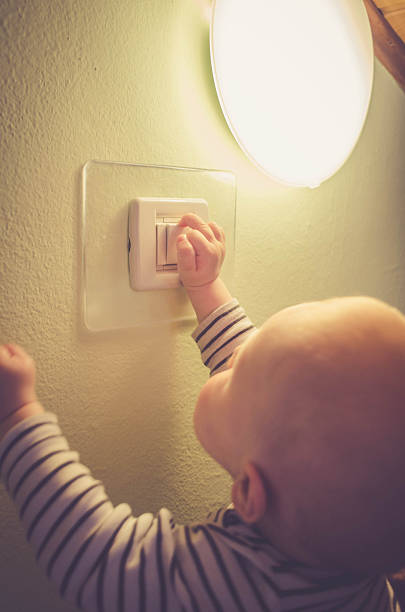istock Baby child switching on / off the light 540095286