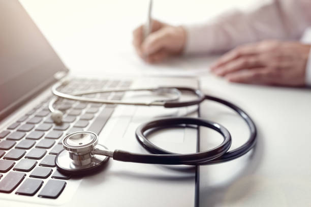 istock Doctor writing prescription or medical examination notes 540096262