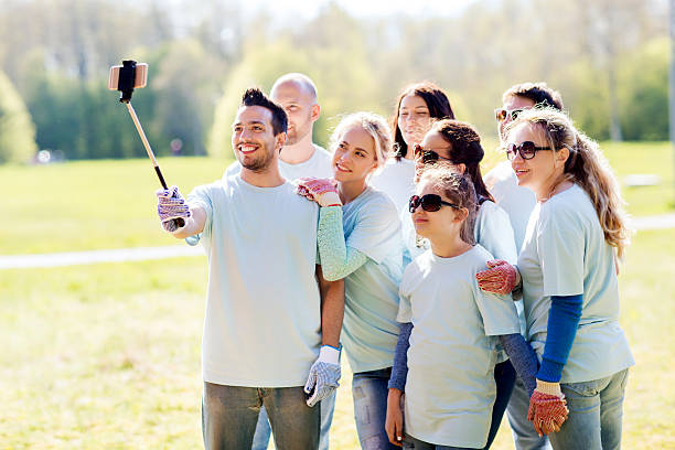 istock group of volunteers taking smartphone selfie 540096588