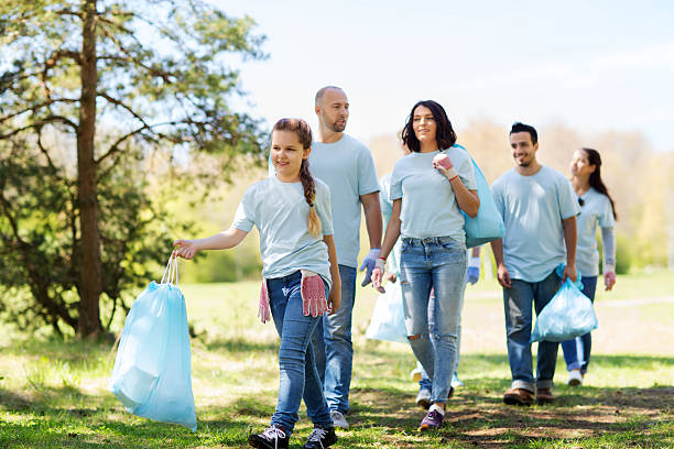 istock group of volunteers with garbage bags in park 540096854