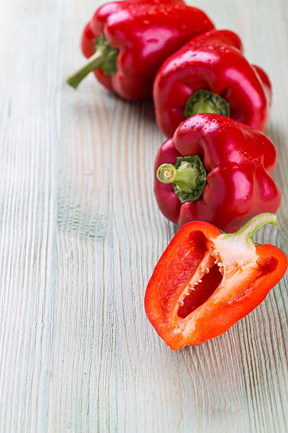 istock Fresh organic bell peppers on a wooden board 540096924