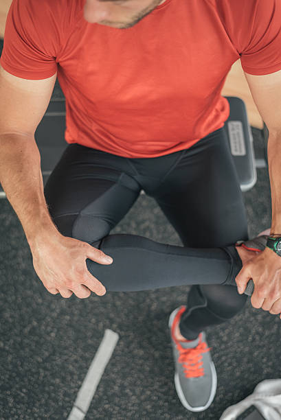 istock healthy man stretching leg before gym workout 540098096