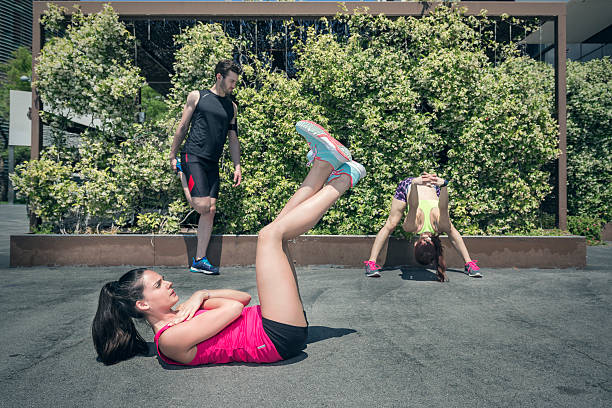 Young athlete woman relaxing after jogging and listening music