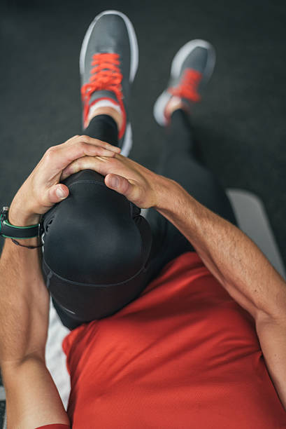 istock healthy man stretching leg before gym workout 540098336