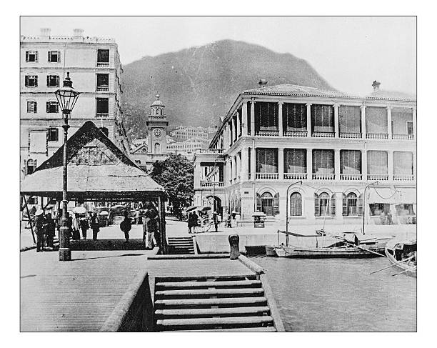 Antique photograph of English buildings in Hong Kong (China)-19th century Antique photograph of English buildings in Hong Kong (China) during the 19th century, mixed with local elements. clock tower photos stock illustrations