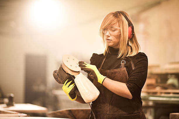 istock Blonde woman with power sander 540100248