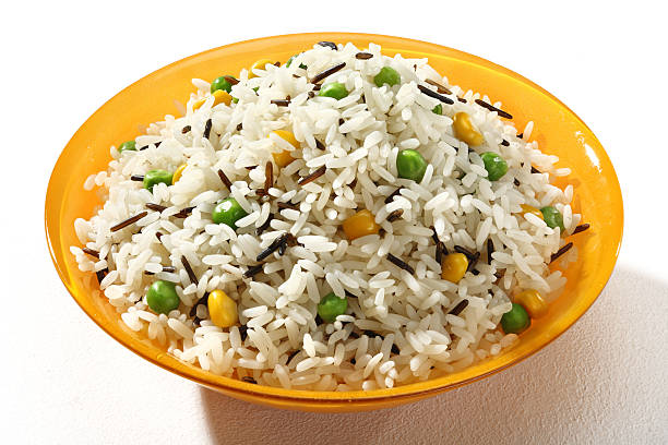 istock Dish of black & white rice in an orange plate 540100556