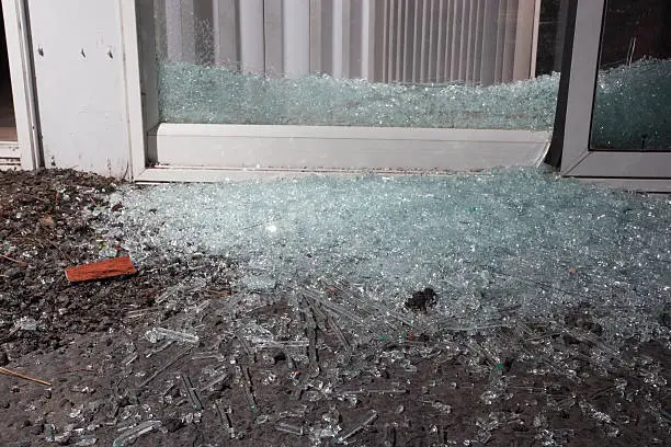Glass from a shattered sliding glass door a home invader broke