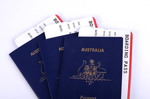 istock Three Australian passports with boarding passes 540100982