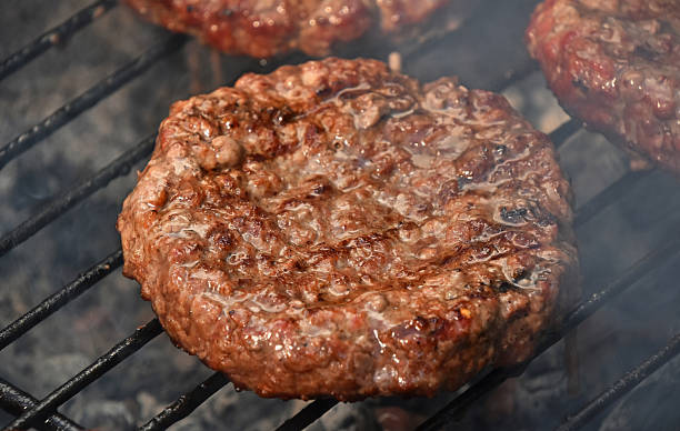 istock Meat burgers for hamburger on smoke grill 540102914