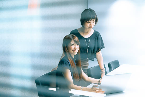 istock japanese women in a board room 540103948